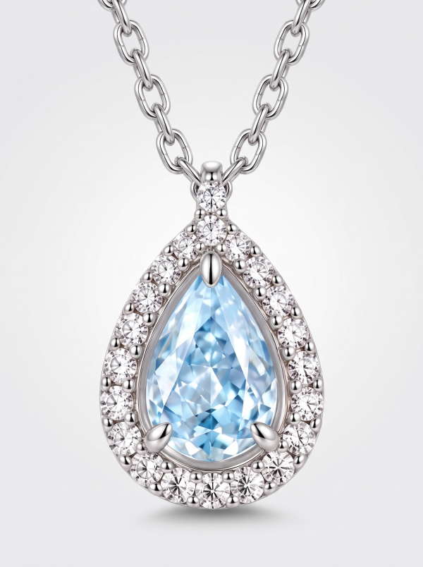 Blue stone teardrop necklace with clear halo accents and a silver-tone chain