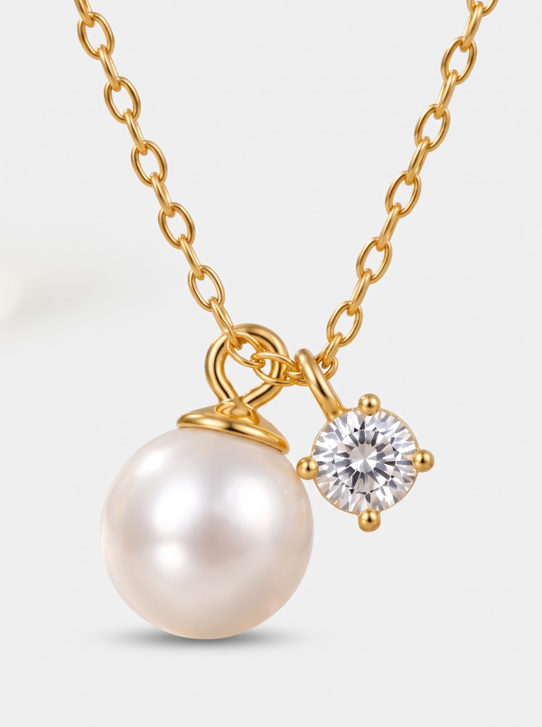 Imitation pearl pendant necklace with a round clear accent and gold-tone chain